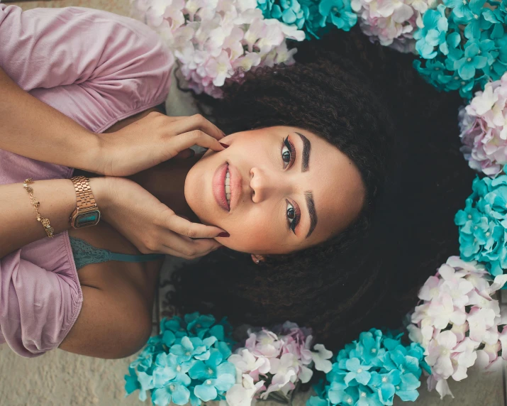 a woman with flowers around her