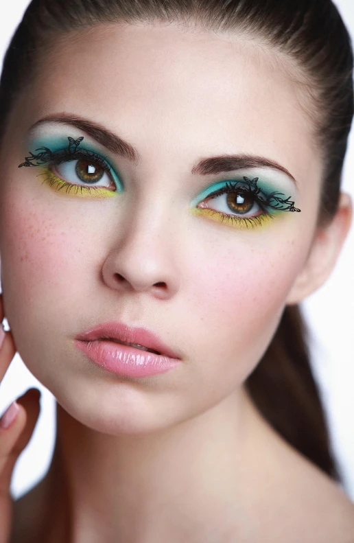 a girl posing with her eyes close to her face