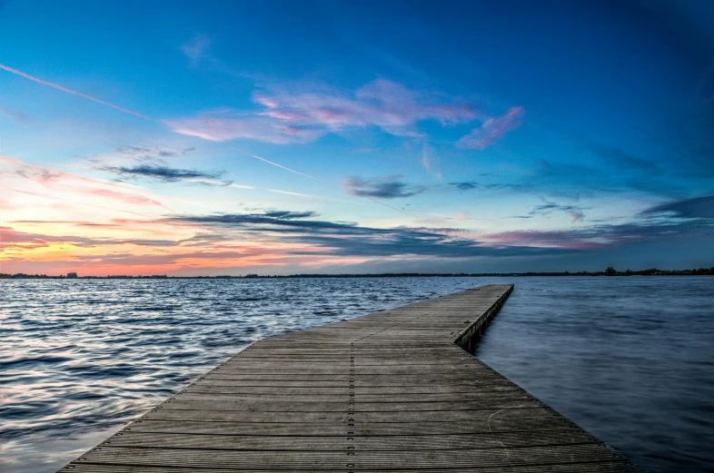 the wooden walkway is out side of the water