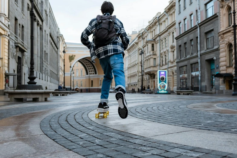 the boy is doing tricks on his skateboard