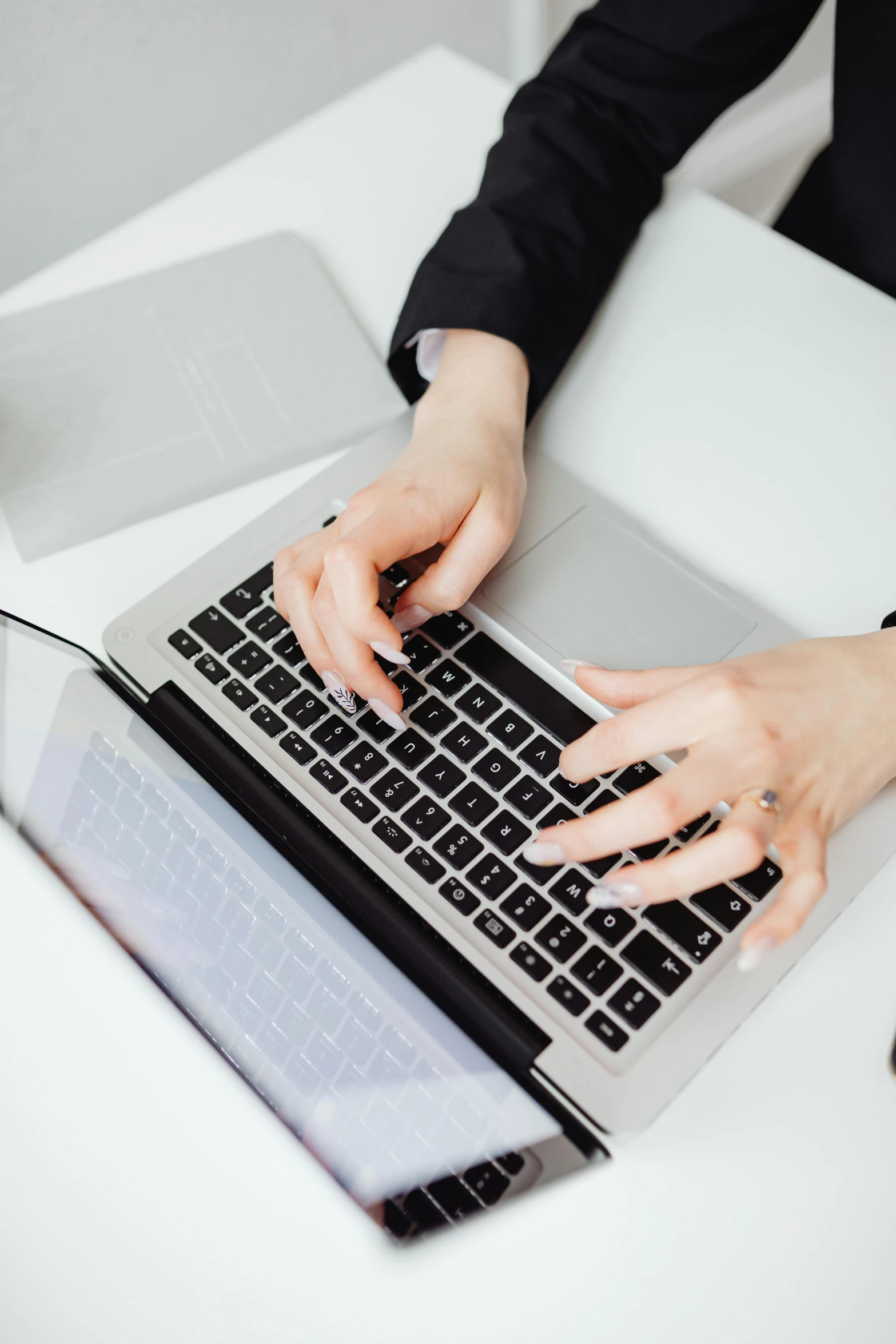 woman working at the table using her laptop computer