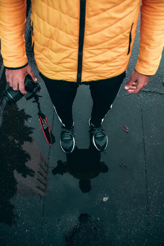 a man is holding a skateboard with its wheels