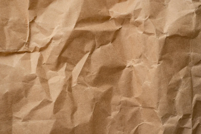 a sheet of brown paper sitting on top of a table