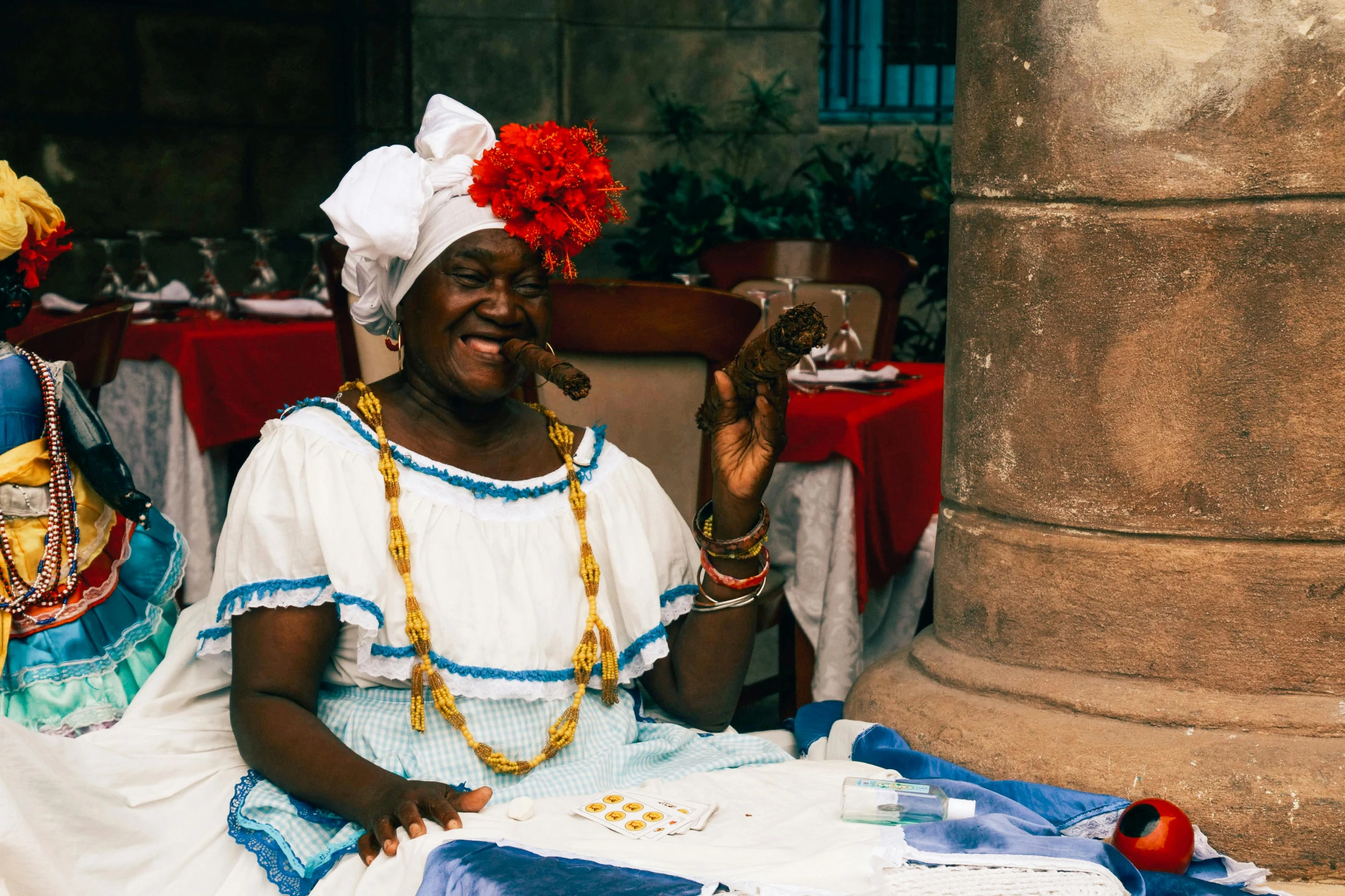 a person sitting down with a plate of food