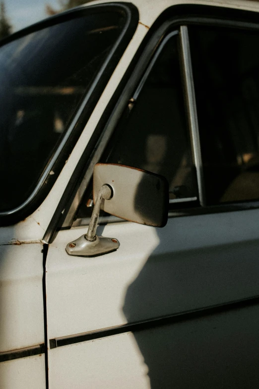 the door handles are still on this dirty white car