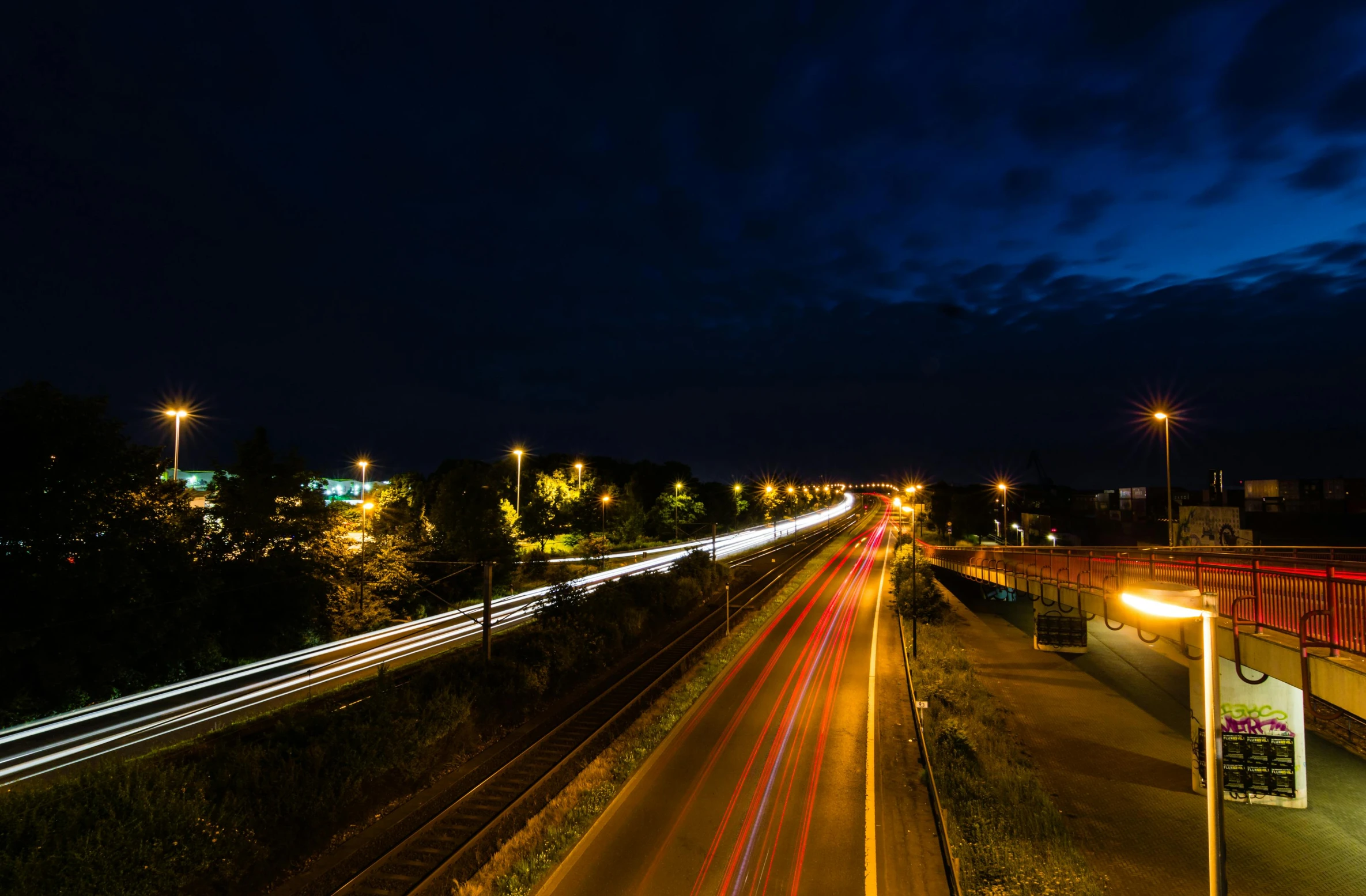 an overhead view of a road with cars moving