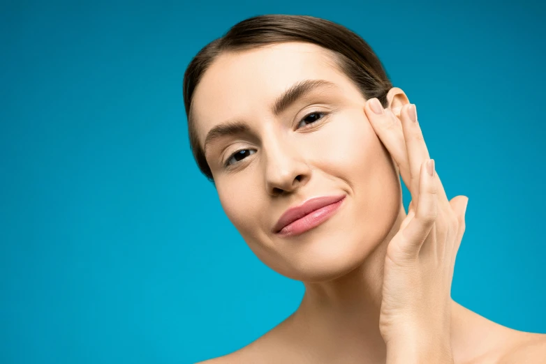 woman with half up hair posing for po