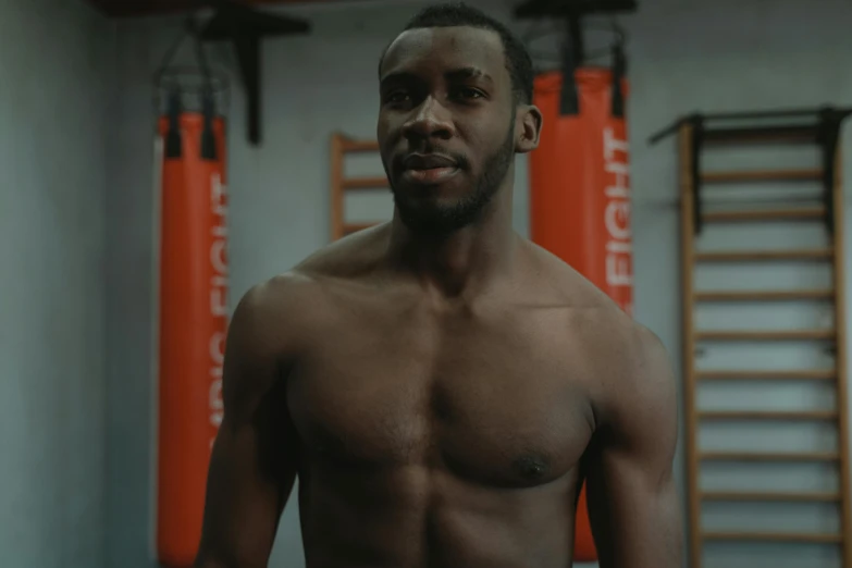 a man with his chest showing as he is getting ready to go in the ring