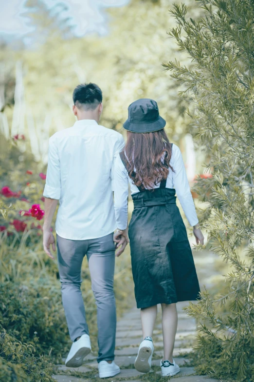 an image of couple walking down a path