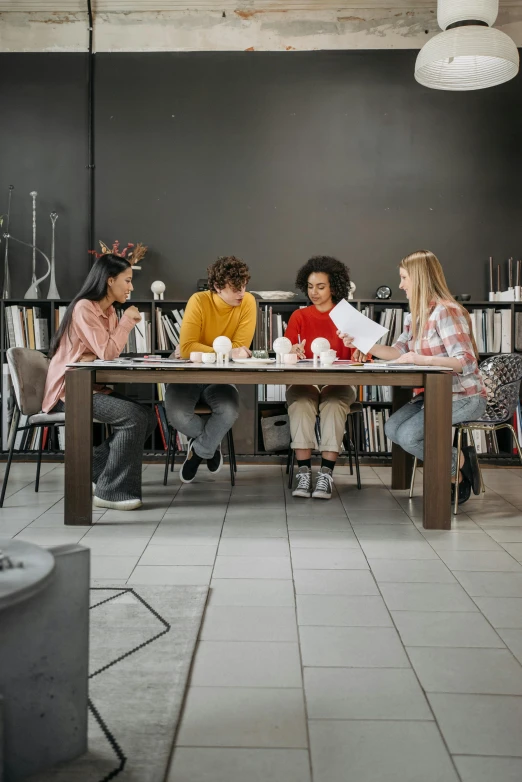 some women are gathered around a dining table