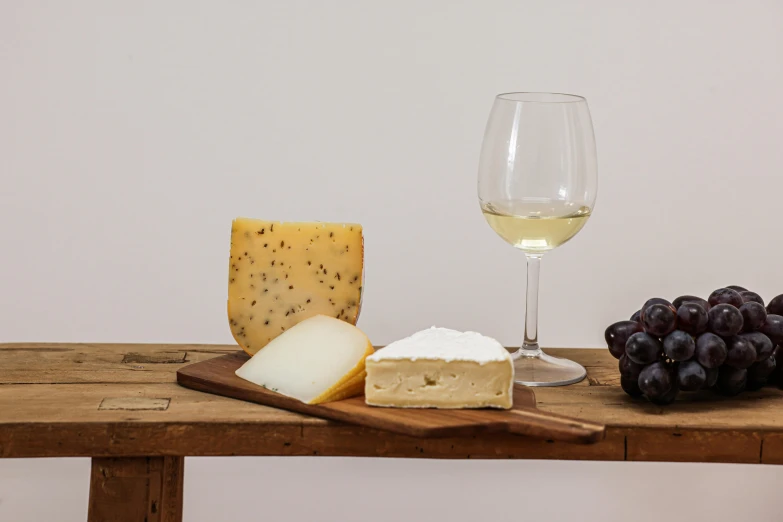 cheese, gs, and cheese board sitting on a table