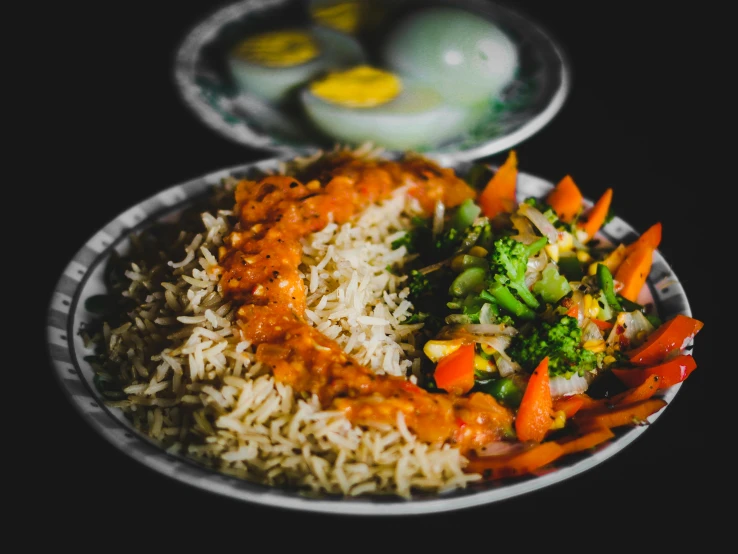 food on a plate is next to two plates on a table