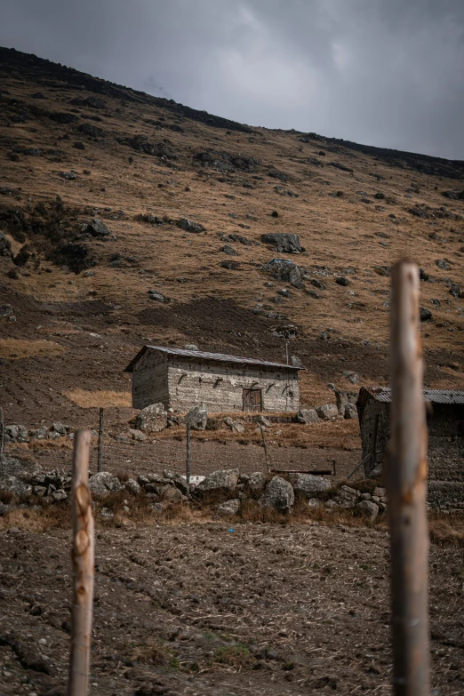 an old house in the middle of the fields