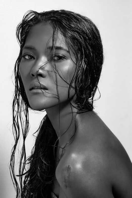 a woman with wet, wet hair in black and white