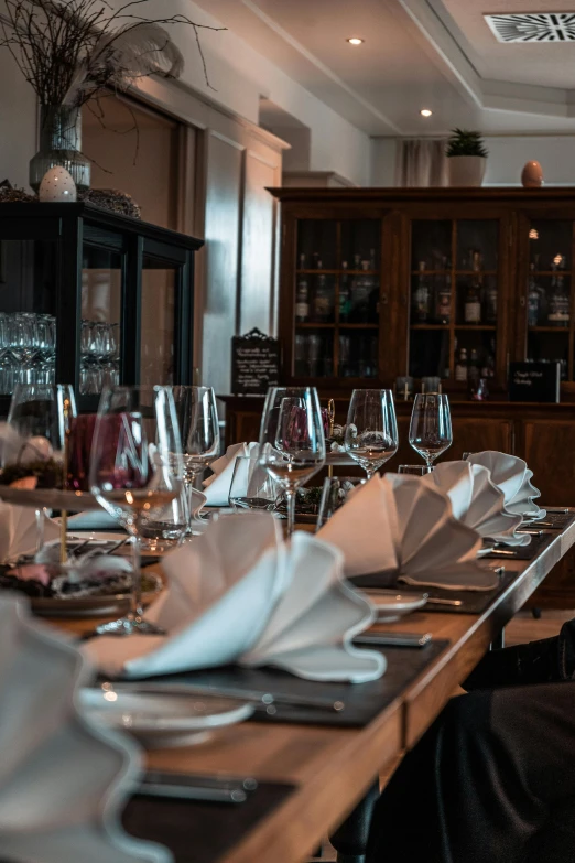 a dining room filled with glasses and plates