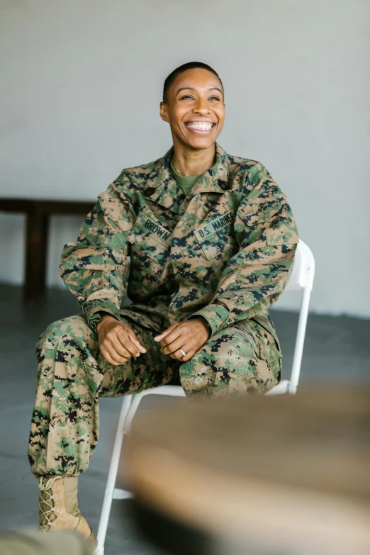 a woman in uniform sitting on a chair