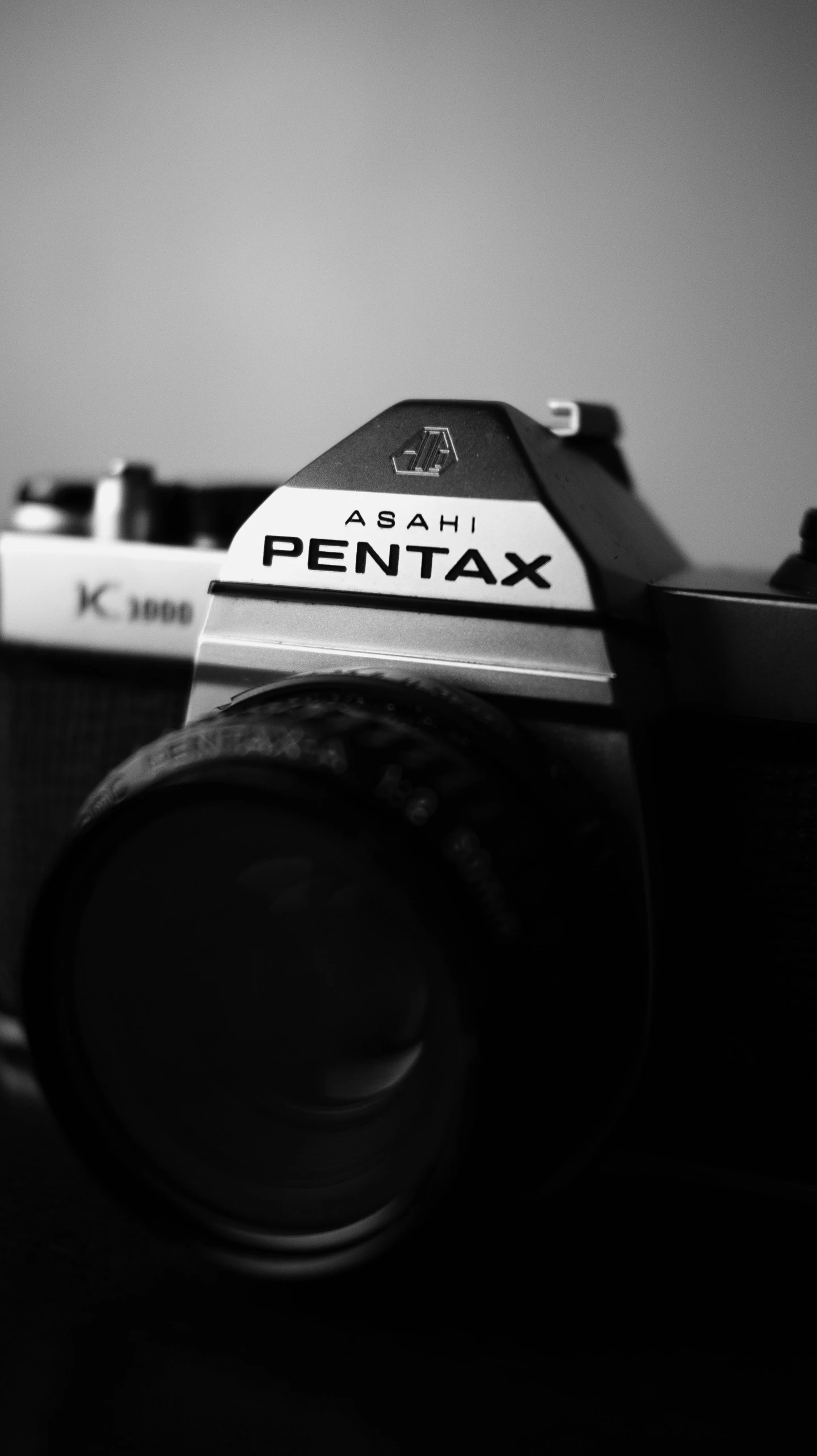 a camera on top of a wooden table with the lens