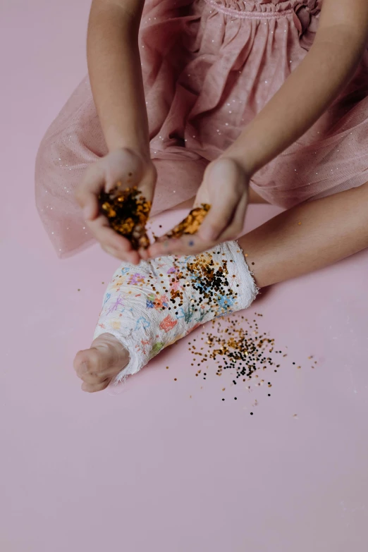 a  eating confetti from a tube