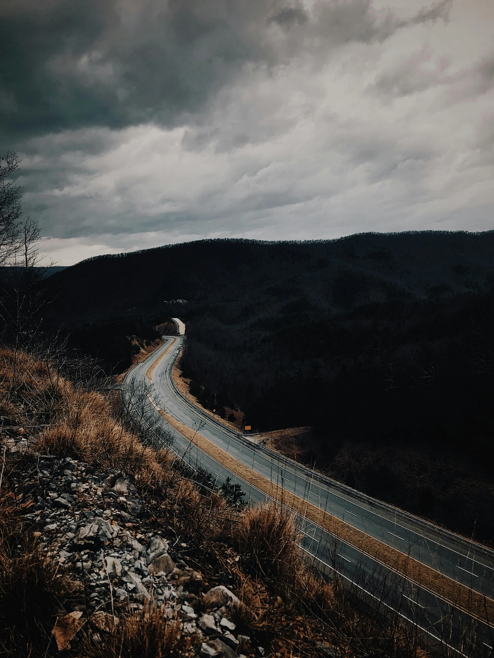 a scenic road running through a mountainous area