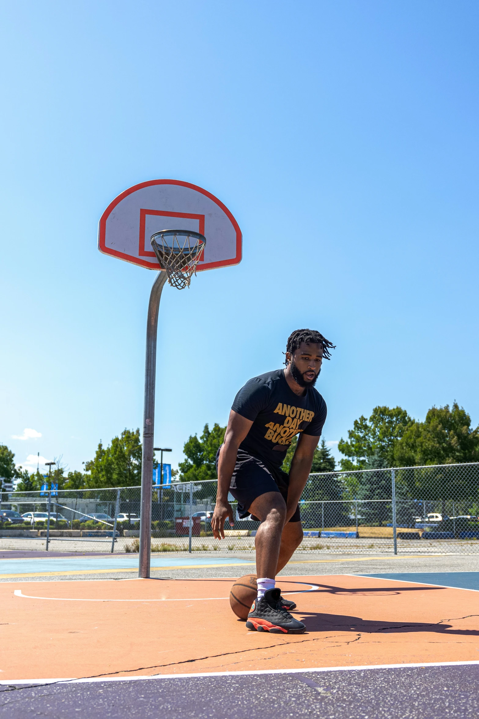 a man is playing basketball on the court