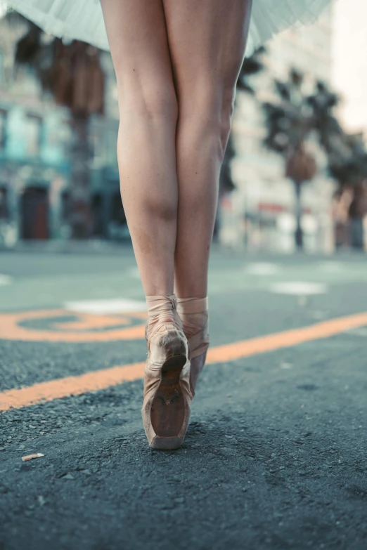 a close up of a female ballet shoe with the bottom of the shoes down