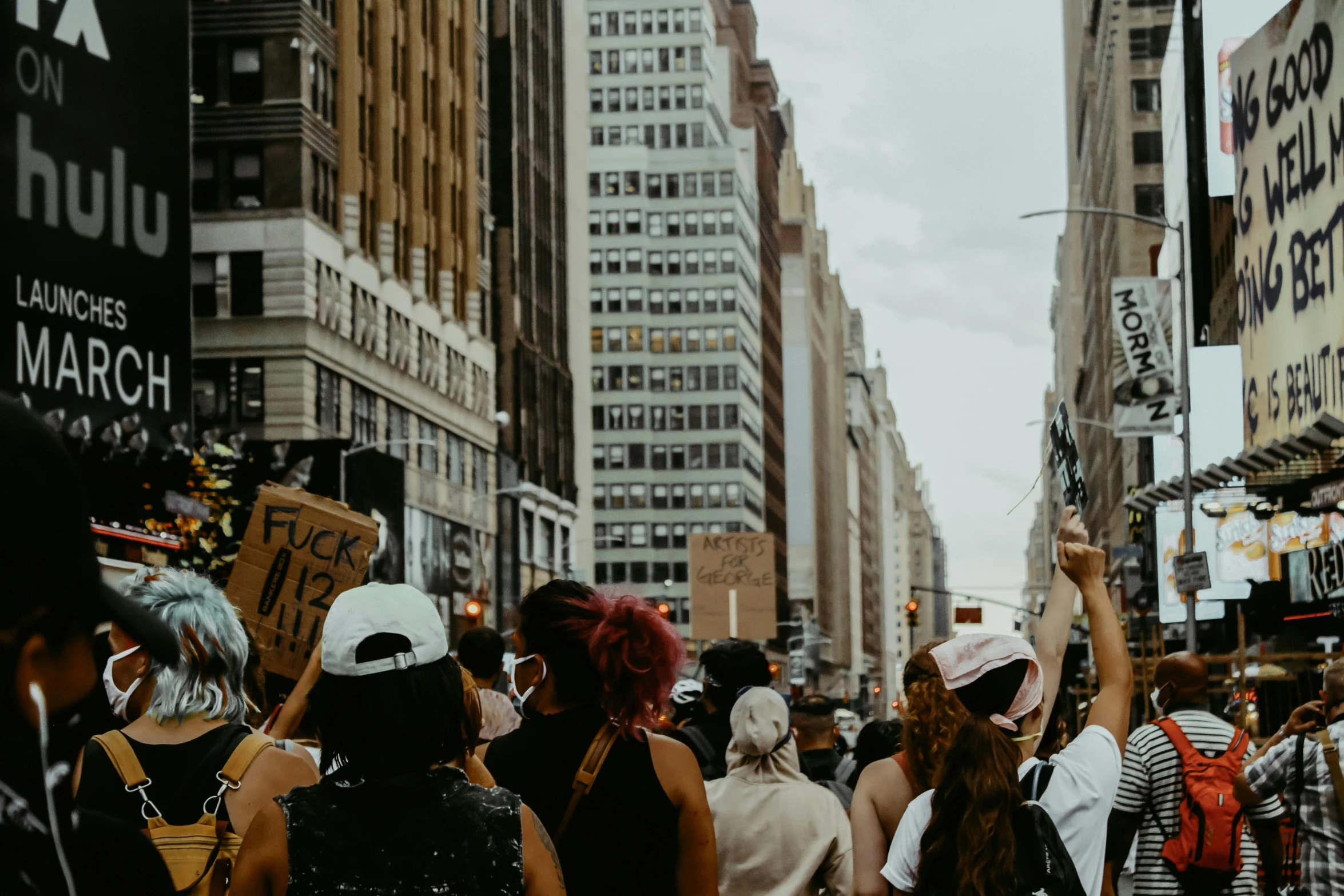 the city with people are holding up signs