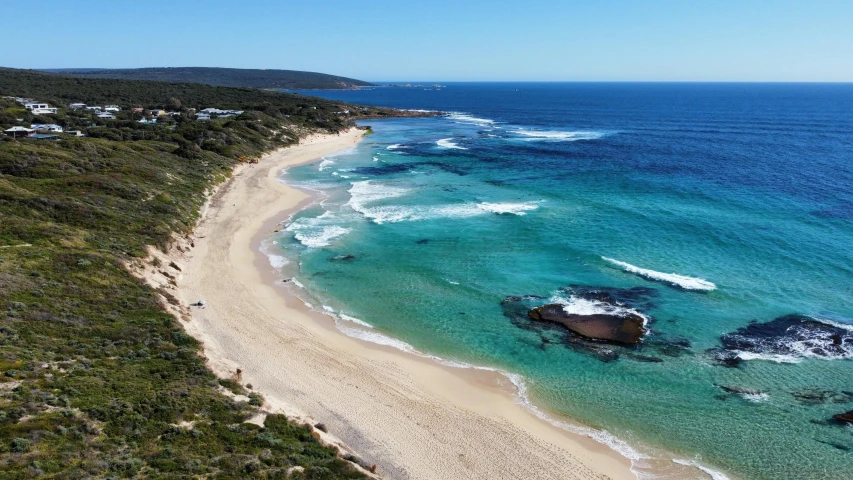 a aerial view of the coast next to an ocean