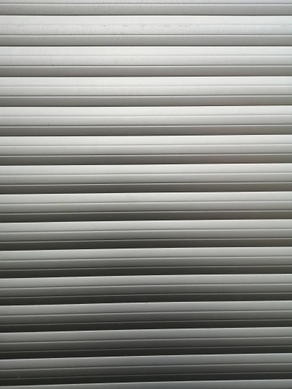 closeup of the blinds on a closed window