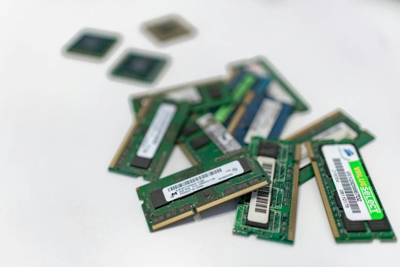 several ram cards are scattered on the surface