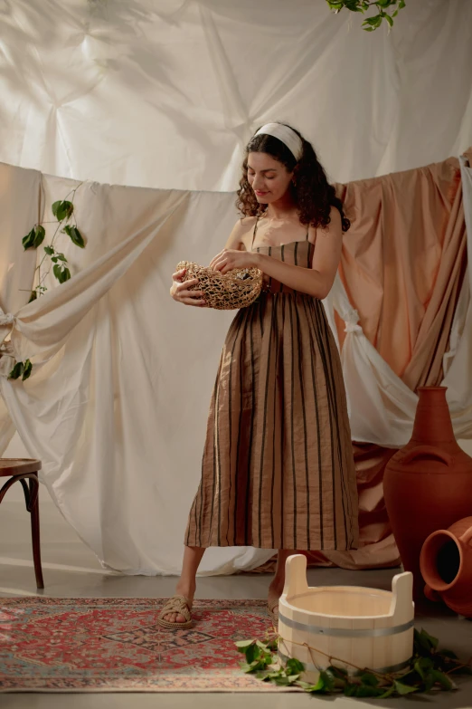 a woman in dress holding a basket while wearing heels