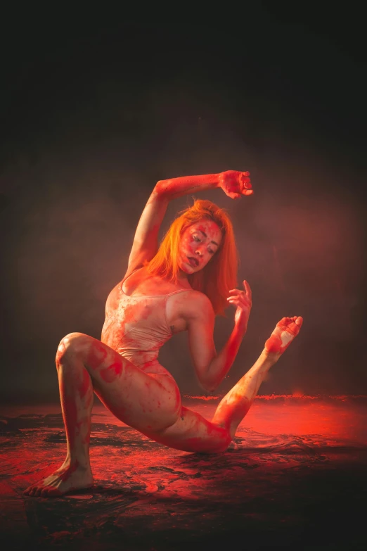 an orange woman posing while the water is red