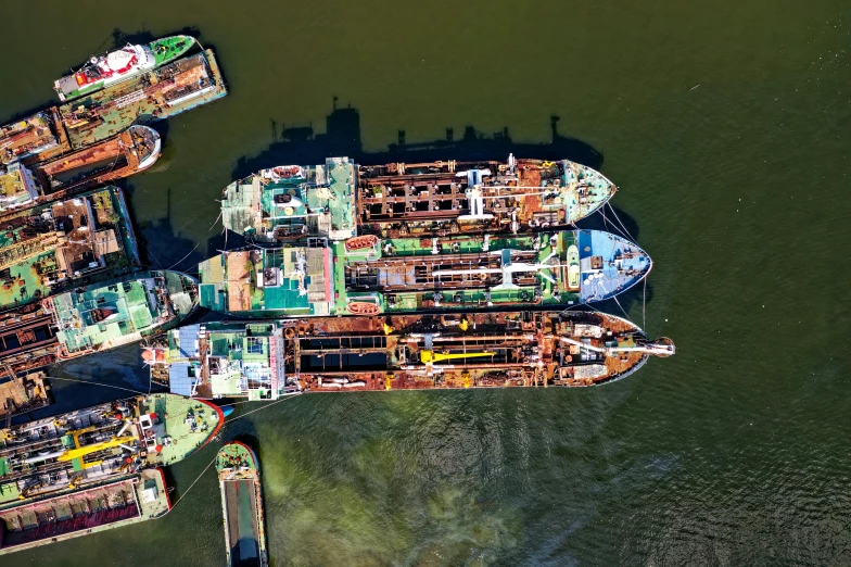 a group of ships are lined up at a dock
