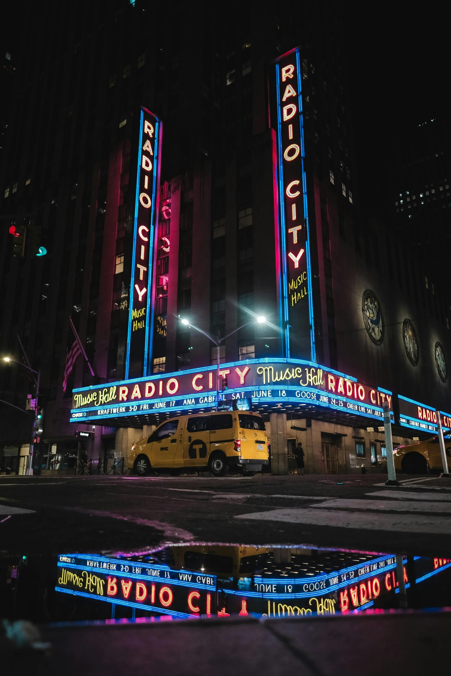 large building with various neon sign letters on each side