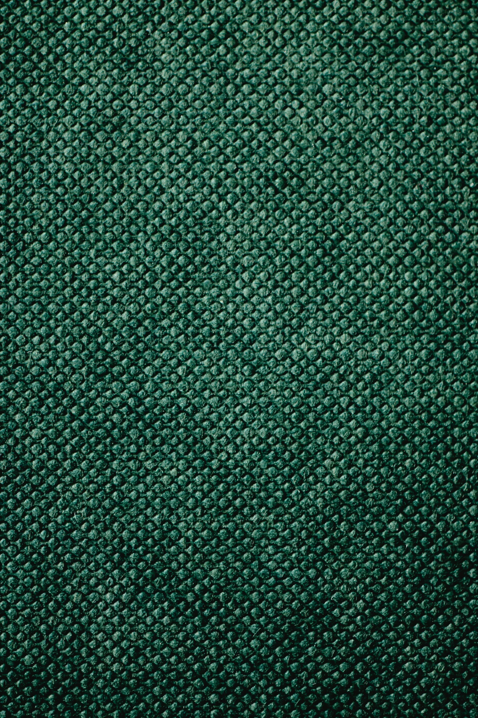 dark green textured fabric with no visible images