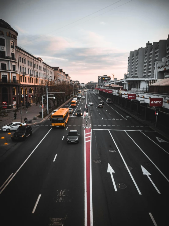 a street with several cars and a bus