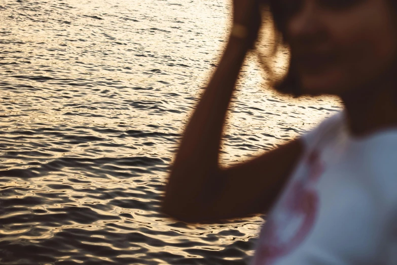 a woman standing on top of a body of water