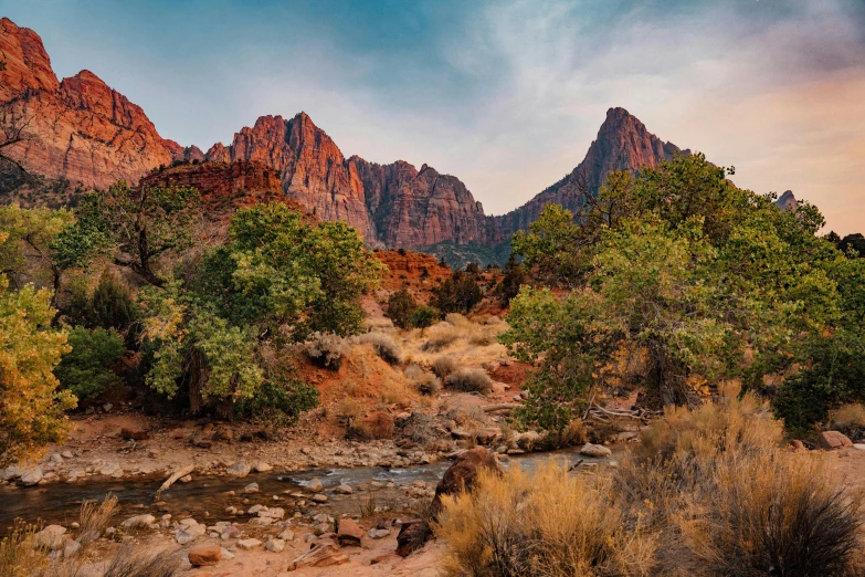 a river in a desert surrounded by mountains