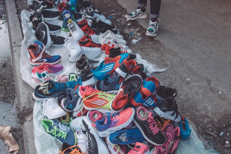 a long line of brightly colored sneakers laid out