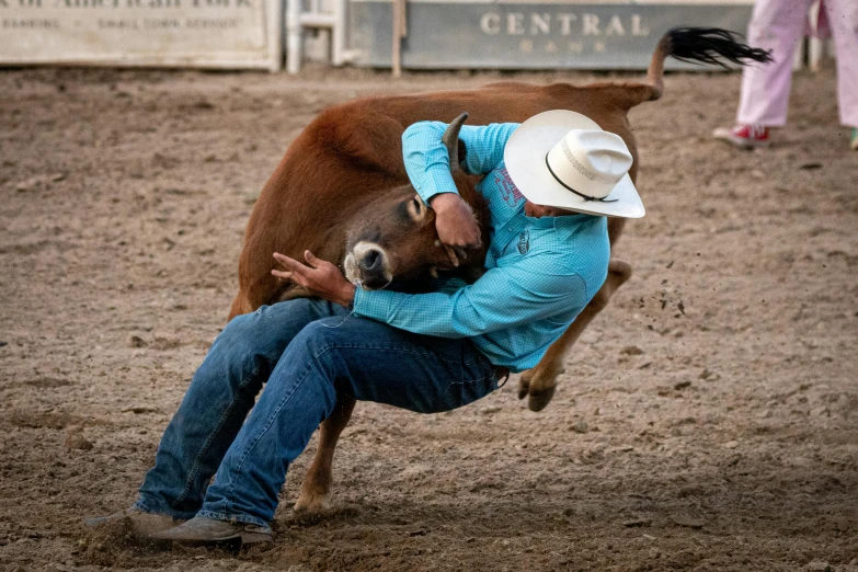 a man is doing a rodeo dance with a horse