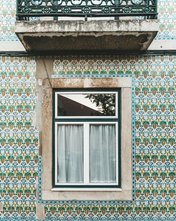 a window on a building with a bird outside