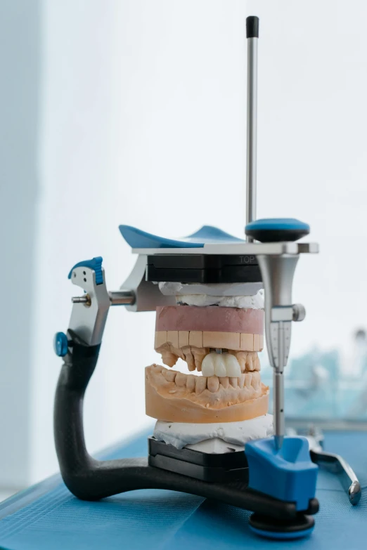 a dental device sitting on top of a table next to a toothbrush