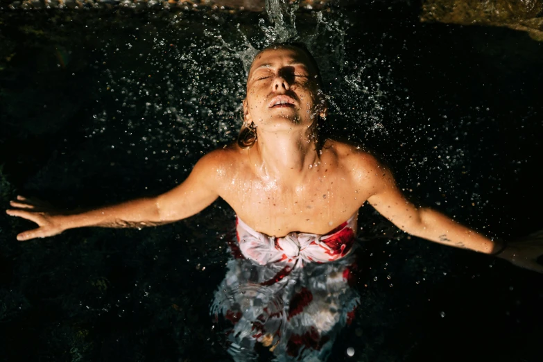 an image of man with his face in the water