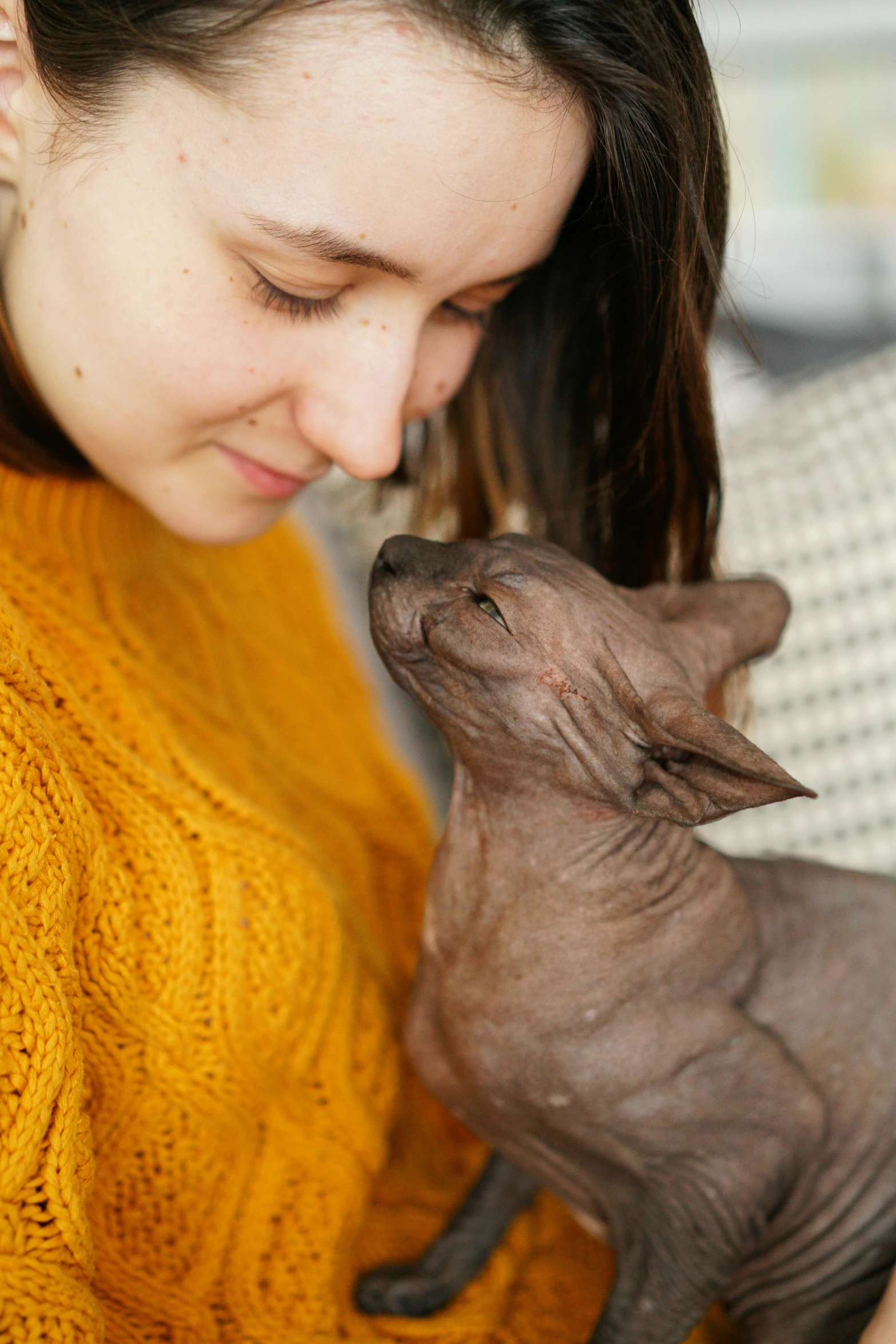 woman with cat, she has very small nose