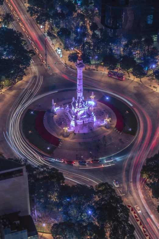 a circular park has lights on top of it