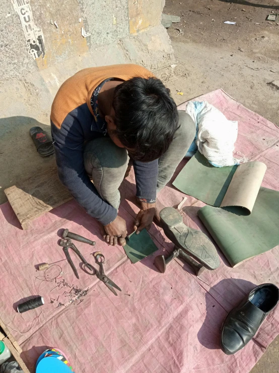 a person at the table making pottery