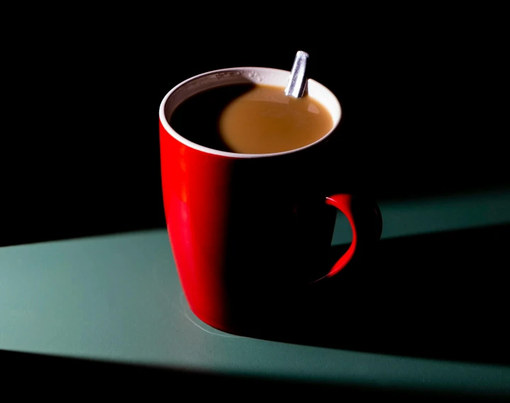 a cup with a straw sits on top of the table