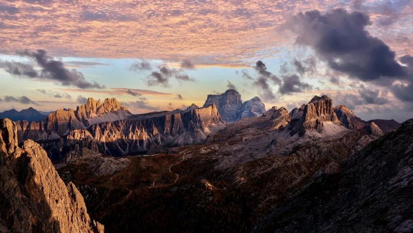 a beautiful mountain sunrise over a snowy mountain range