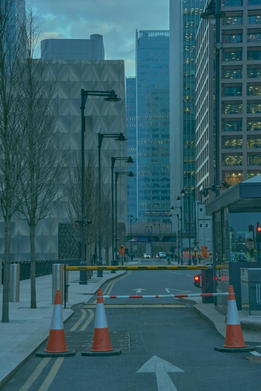 a city street with construction cones and orange cones