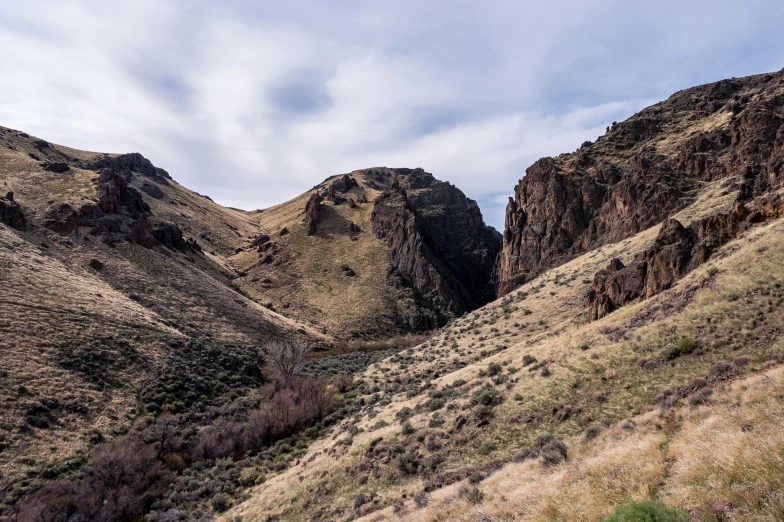 there are mountains and green vegetation on this hill