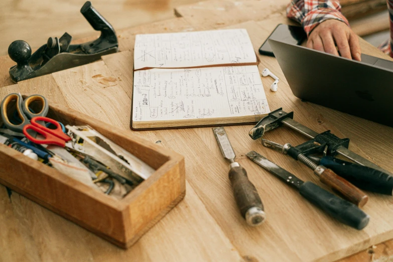 the tools are organized on a table near a box